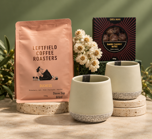 Coffee Blend, ceramic tumblers and chocolate on green background