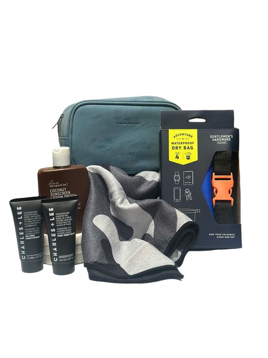 Grooming kit with toiletries, towel, and accessories on a white background
