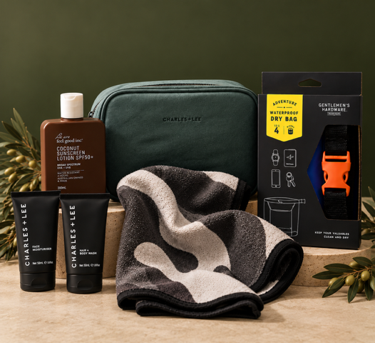 Mens grooming products, towel and dry bag on green background.