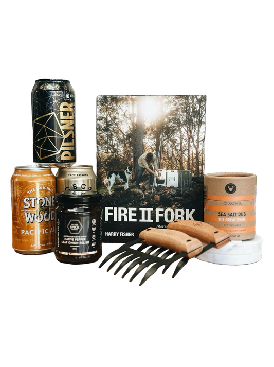 Collection of items including beer cans, a book, and meat claws on a white background