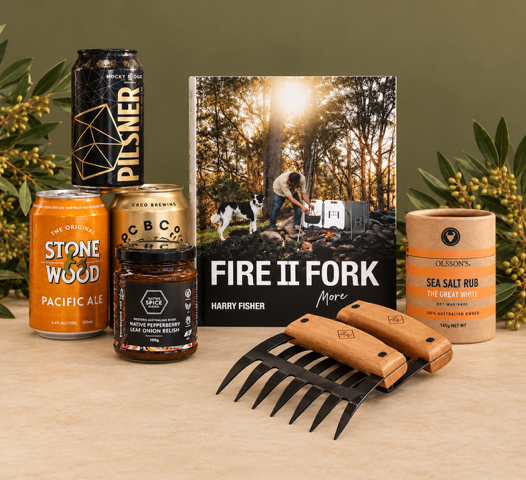 Collection of items including beer cans, a book, and meat claws on a white background