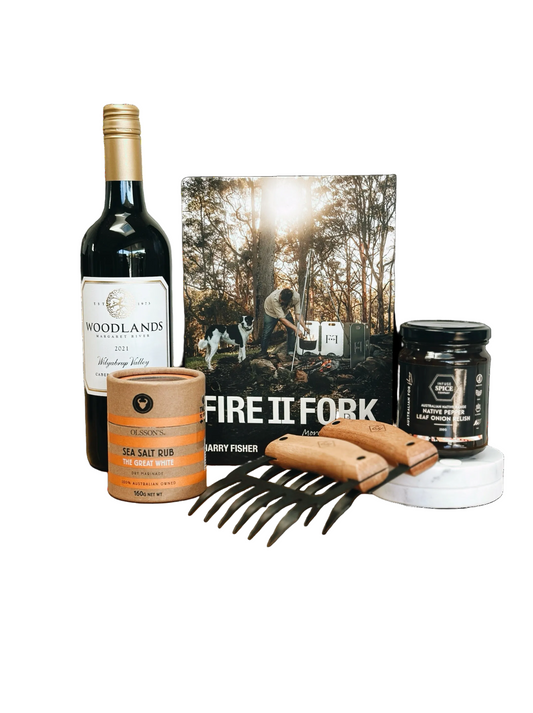 Collection of items including a bottle, book, and kitchen tools on a white background