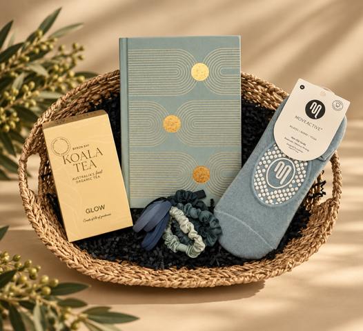 Basket with a blue book, blue sock, and other items on a beige background