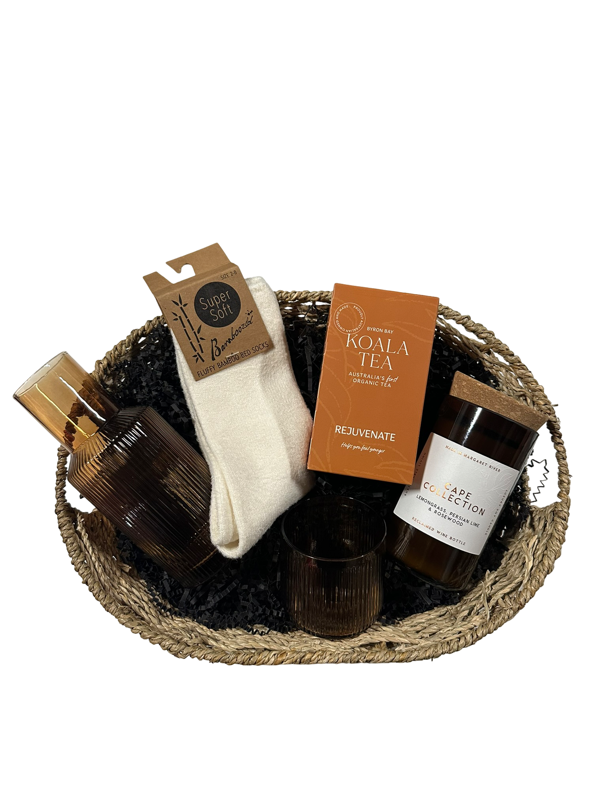 Gift basket with items including a bottle, socks, and tea on a white background
