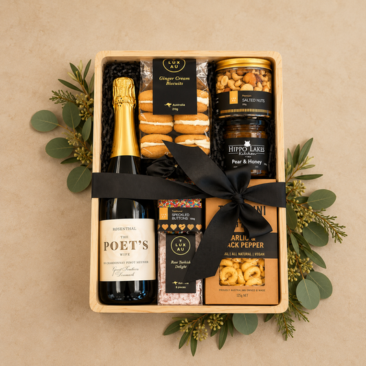 A beautifully curated Christmas gift filled with premium gourmet favourites and indulgent treats. Featuring The Poet’s Wife Chardonnay Pinot Meunier, artisan ginger cream biscuits, premium salted nuts, pear & honey preserve, rose Turkish delight, colourful speckled chocolate buttons and savoury garlic & black pepper tarallini.
Presented in a stylish timber gift box with a luxurious black satin bow, this generous collection is perfect for sharing and celebrating over the festive season. 
