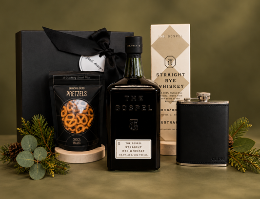 A sophisticated gift designed for the whiskey lover, featuring The Gospel Straight Rye Whiskey, a sleek Clingo leather flask, and Choca Mama crunchy salted pretzels for the perfect savoury pairing. Beautifully presented in our signature black gift box, this is a timeless combination of premium spirits, stylish accessories and indulgent treats — perfect for celebrating a special occasion or showing appreciation.