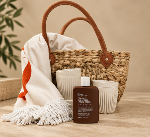 Basket with a towel, two white containers, and a brown bottle on a beige background