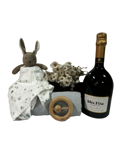 Gift box containing bottle of sparkling, comforter, swaddle and teether.