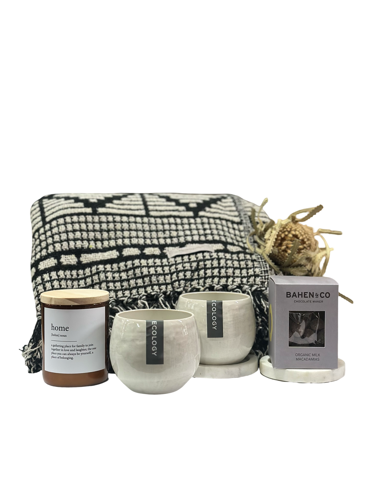 Set of candles and a blanket with 'Bahlen & Co' branding on a white background